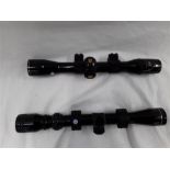 A Nikki Stirling Silver Crown 4x32 rifle scope together with another. (R32)