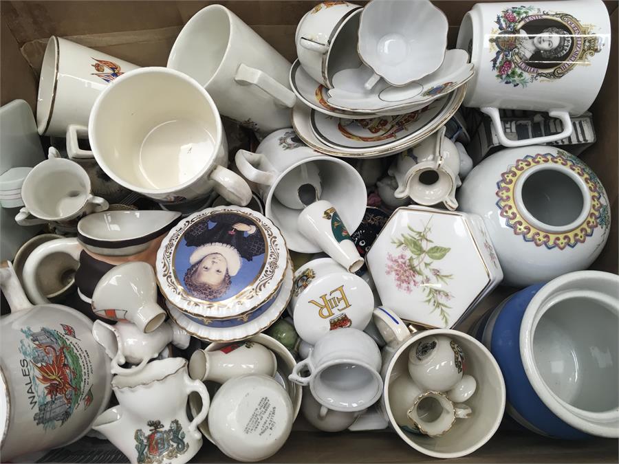 A box of royal memorabilia and other china collectables.