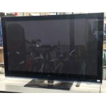 An LG flat screen TV Model 60PS8000, with a 60” screen. Includes remote.