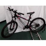 A kid’s Cannondale mountain bike. 24 speed with front suspension, hydraulic disc brakes and numerous