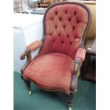 An early mahogany button back parlour chair resting on ceramic castors, together with a small oak