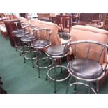 A set of six chrome high kitchen stools.