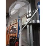 An electric 3 speed fan on stand.