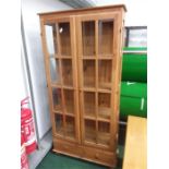 A quarter glazed pine display cabinet.