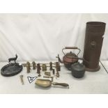 A quantity of brass and copper items, including kettles and an umbrella stand.