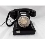 A vintage Bakelite telephone.