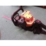 A Partner twin edged petrol hedge trimmer.