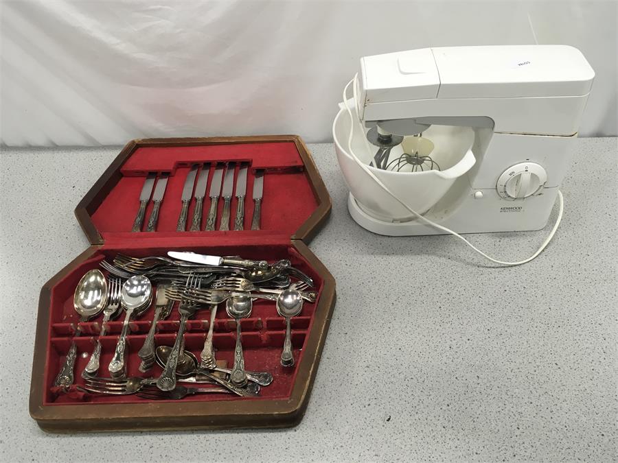 A cutlery canteen with a Kenwood food mixer.