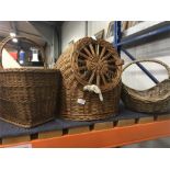 Three wicker baskets, including one for pets.