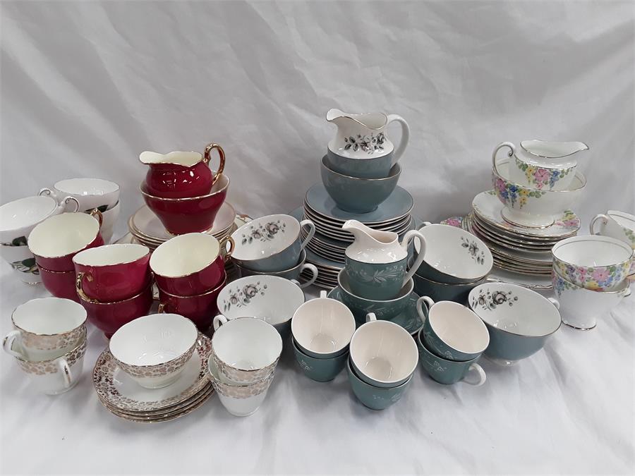 A box containing the residue of various tea sets to include Salisbury, Adderley and Royal Doulton