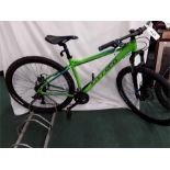 A Carrera mountain bike. 24 speed with front suspension and mechanical disc brakes. Some rust on