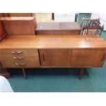 A teak retro sideboard.