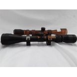 A Nikki Stirling 3-ox40 Mount Master rifle scope together with a Simmons 3-9x40 rifle scope rim