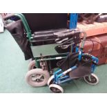 A Gallager wheelchair together with a folding walking frame.
