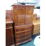 A yew wood drinks cabinet.