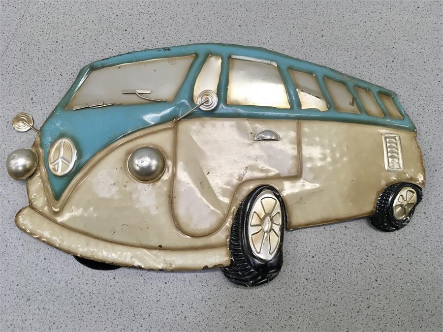 A piece of wall art depicting a campervan.