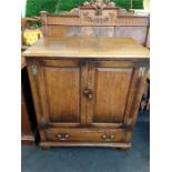 A Titchmarsh & Goodwin oak Television Cabinet with accessory drawer.