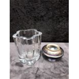 A clear glass vase by strombeshatten together with a Louis comfort Tiffany iridenscent glass vase (