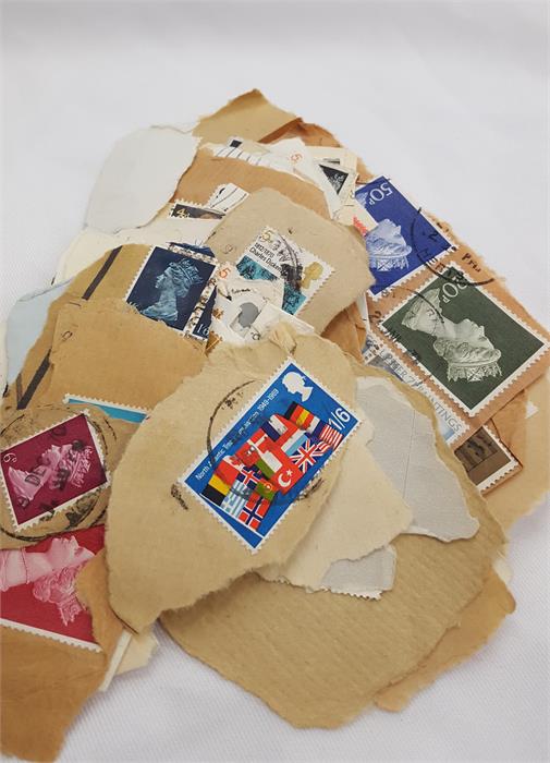 A box containing a large amount of world stamps. - Image 4 of 10