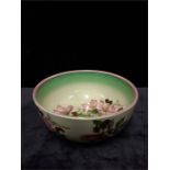 A 1930 40s floral Clarice Cliff bowl.decorated in green and bands of flowers