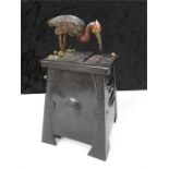 A 1930's design shop display cigarette dispenser in cast metal and decorated with a stork.