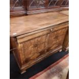 A antique walnut french verneered chest of four drawers.