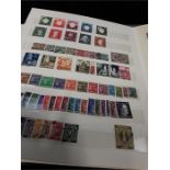 A green album of German stamps.