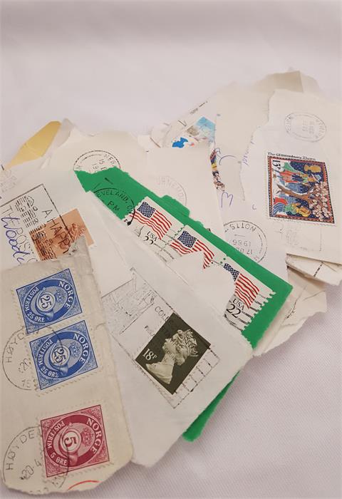 A box containing a large amount of world stamps. - Image 2 of 10