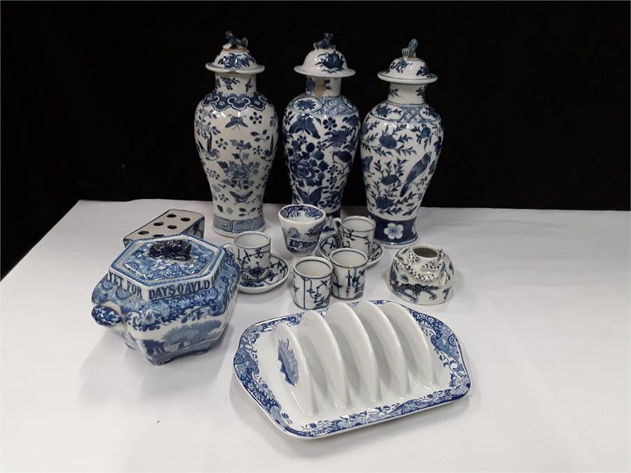 A collection of blue and white Chinese items to include brush, washer with dragon, stem holder,