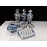 A collection of blue and white Chinese items to include brush, washer with dragon, stem holder,