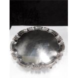 A silver Salver with shaped edge resting on ball feet Sheffield 1922 844 grams