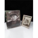 Two plain silver photo frames.