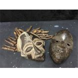 Two African tribal face masks; Origin Angola and Liberia.