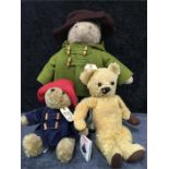 A large Paddington soft bear together with a small Paddington bear and a vintage stuffed bear (