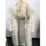 a ladies Artic fox fur long coat and wrap