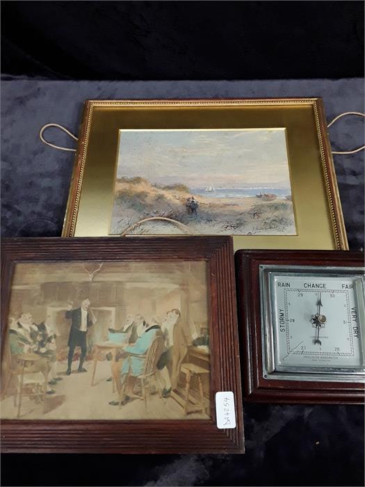 A framed and signed watercolour of a beach scene by Buller Goodwin together with a framed print