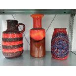 Three items of German red orange and blue 60's pottery.