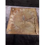 A engraved brass sundial. dated