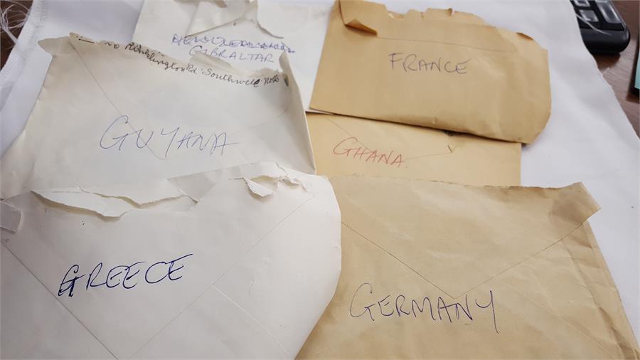 A box containing a large amount of world stamps. - Image 8 of 10