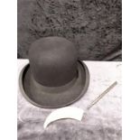 A Bowler hat together with a antique walrus tusk and a silver dip fluted pen.