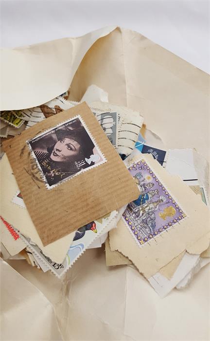 A box containing a large amount of world stamps. - Image 7 of 10