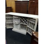 A custom made distressed white/grey fold up wooden drinks bar. fitted int for glass bottles etc