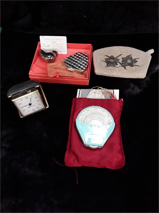 A tub of collectables to include Folli Folli compact and box, beaded purse etc.