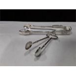 A pair of Silver sugar tongs and a pair of nips