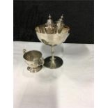 a Silver champagne cup with one other with two small salts