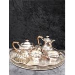 A silver plated 4 piece teaset on gallery tray.