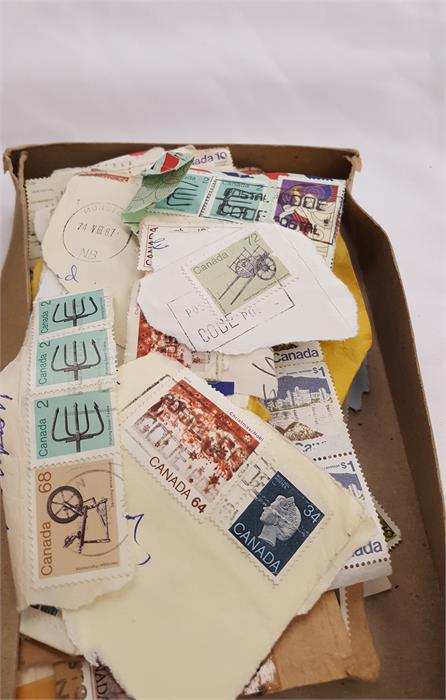 A box containing a large amount of world stamps. - Image 9 of 10