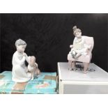 A Lladro boy with dog ref 4522 together with a Lladro birthday surprise ref -6511.