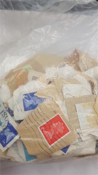 A box containing a large amount of world stamps. - Image 5 of 10