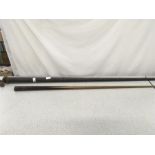 A vintage billiard cue in a metal carrying case.